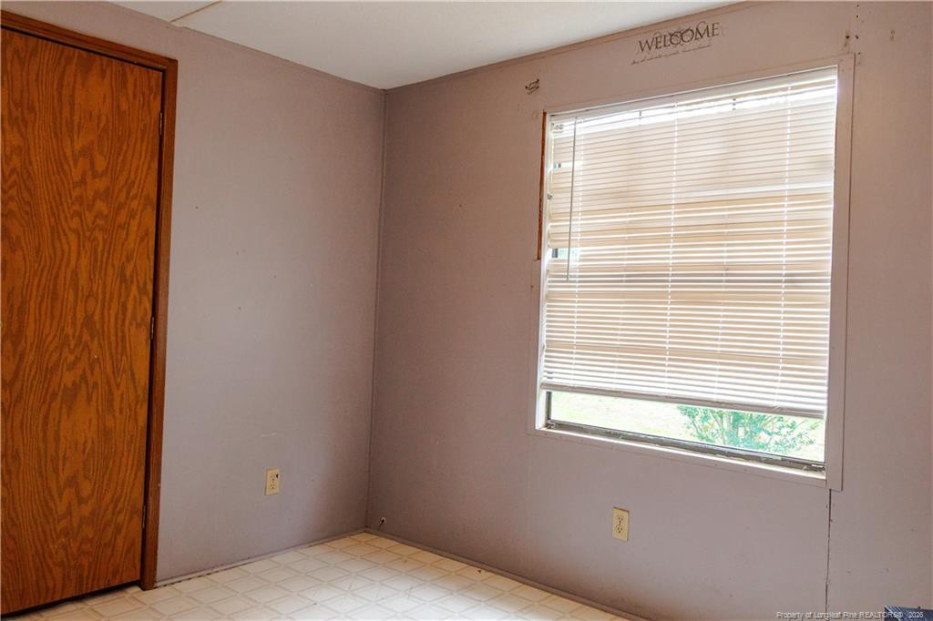 231 Knight Lane Autryville, NC 28318 - Photo 27 of 27 a view of an empty room with a window
