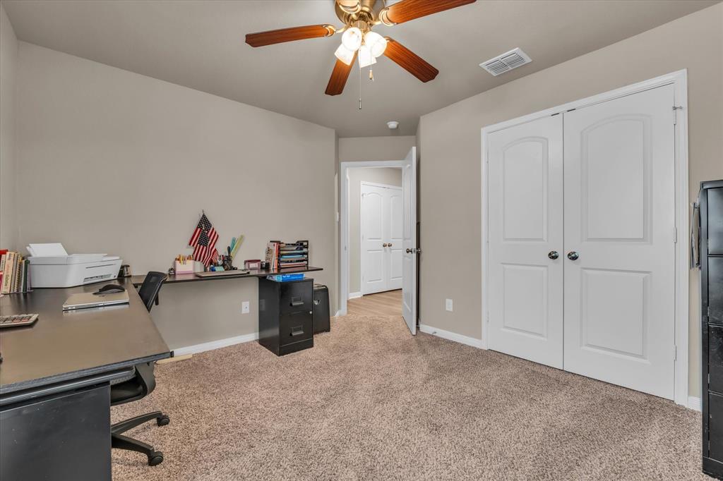 917 North Fork Ranch Road Waco, TX 76705 - Photo 18 of 23 a view of a workspace with furniture and a chandelier fan