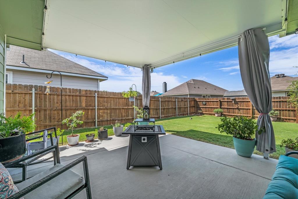 917 North Fork Ranch Road Waco, TX 76705 - Photo 19 of 23 a table and chairs sitting in front of a house