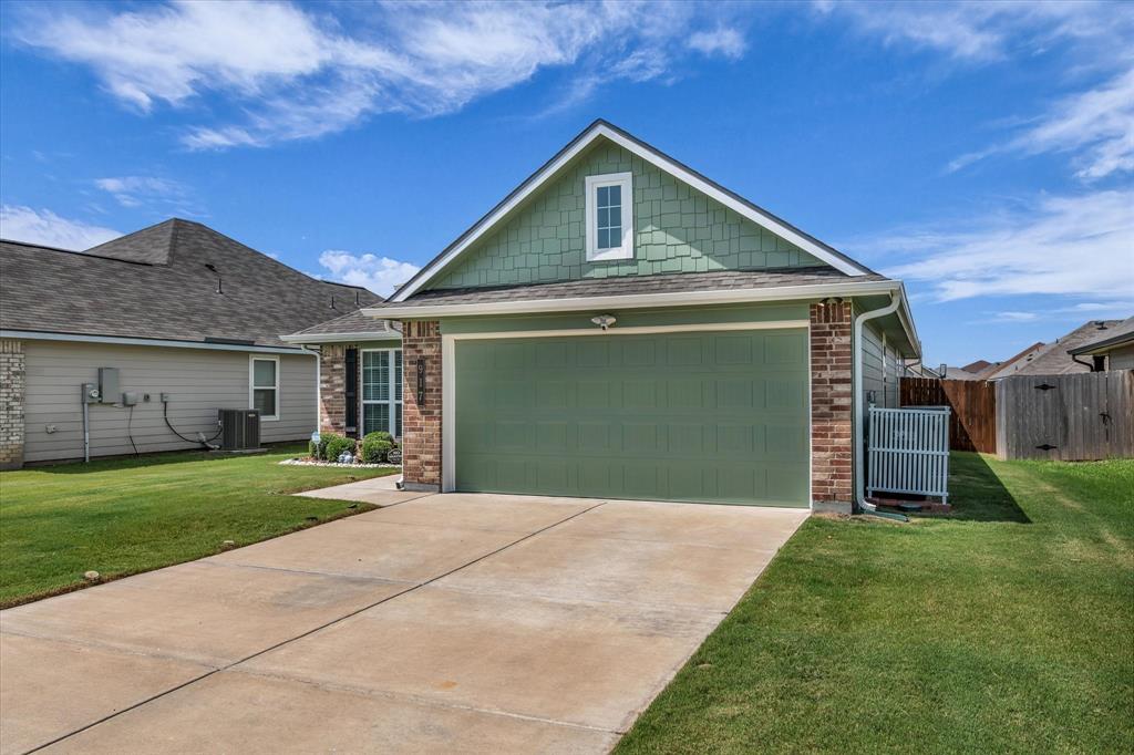 917 North Fork Ranch Road Waco, TX 76705 - Photo 2 of 23 a front view of a house with a yard and garage