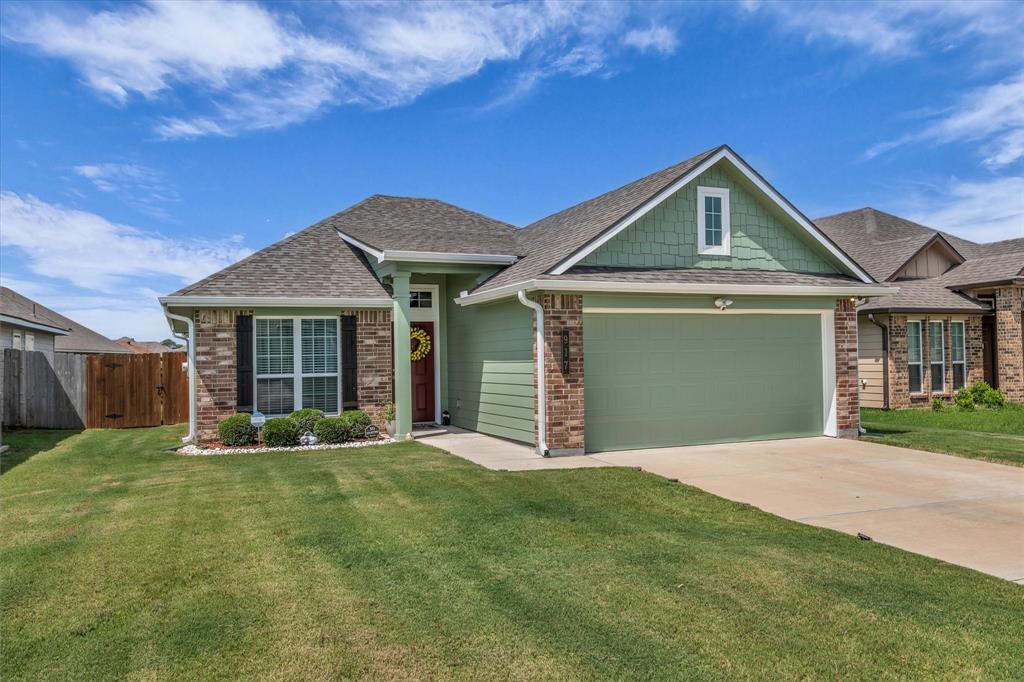917 North Fork Ranch Road Waco, TX 76705 - Photo 3 of 23 a front view of a house with a yard and garage