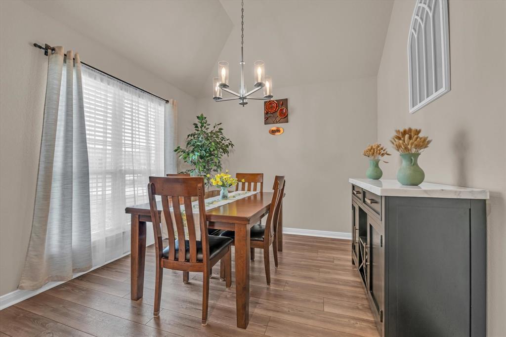 917 North Fork Ranch Road Waco, TX 76705 - Photo 5 of 23 a view of a dining room with furniture and wooden floor