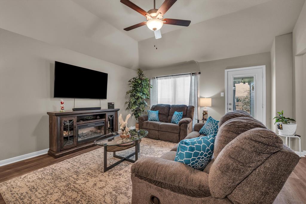 917 North Fork Ranch Road Waco, TX 76705 - Photo 9 of 23 a living room with furniture and a flat screen tv