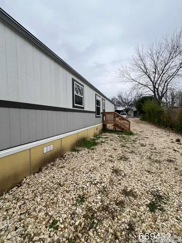 a view of a backyard of the house