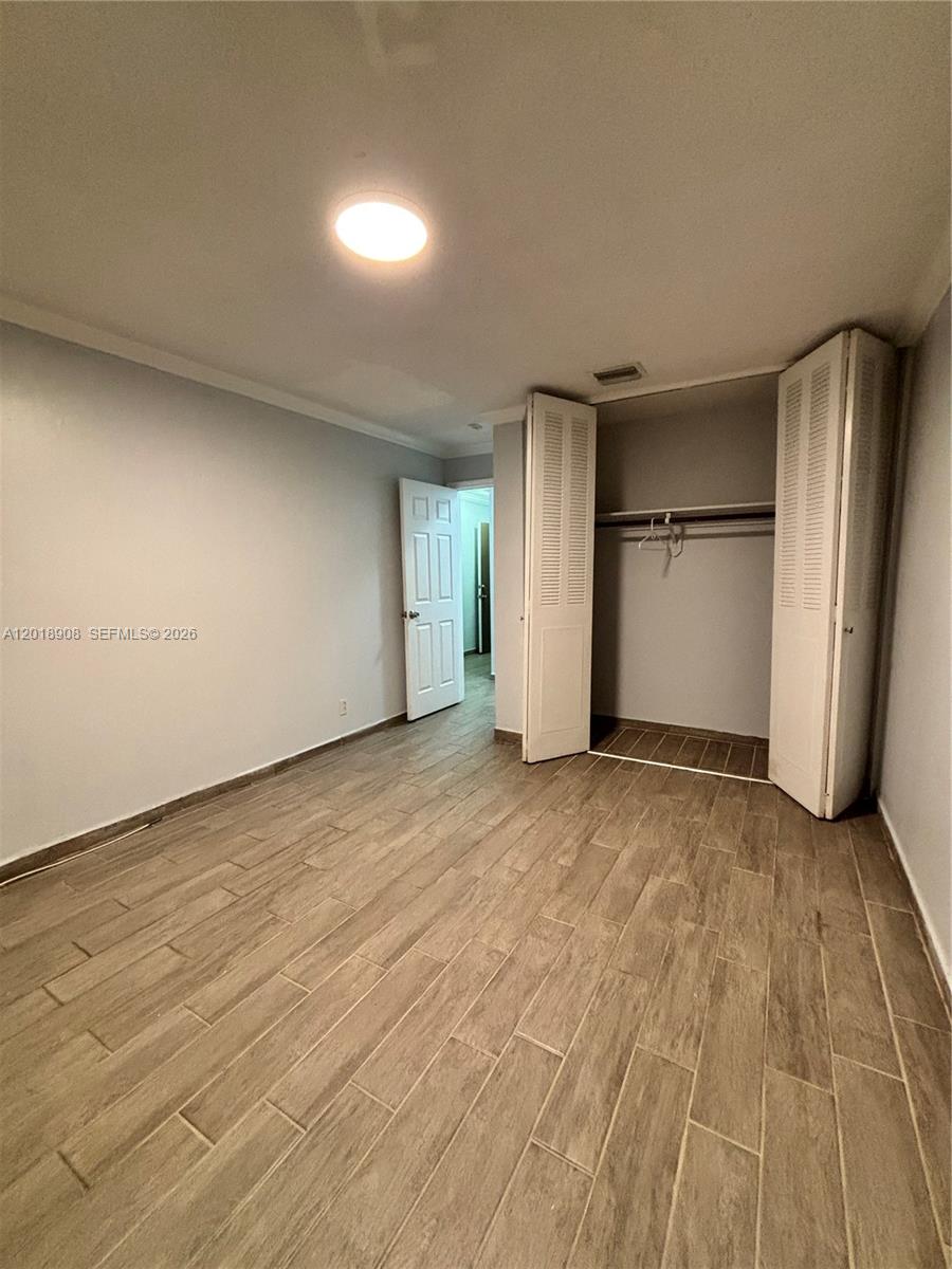 1480 East Sample Road, Unit 209 Pompano Beach, FL 33064 - Photo 15 of 24 a view of an empty room and closet area