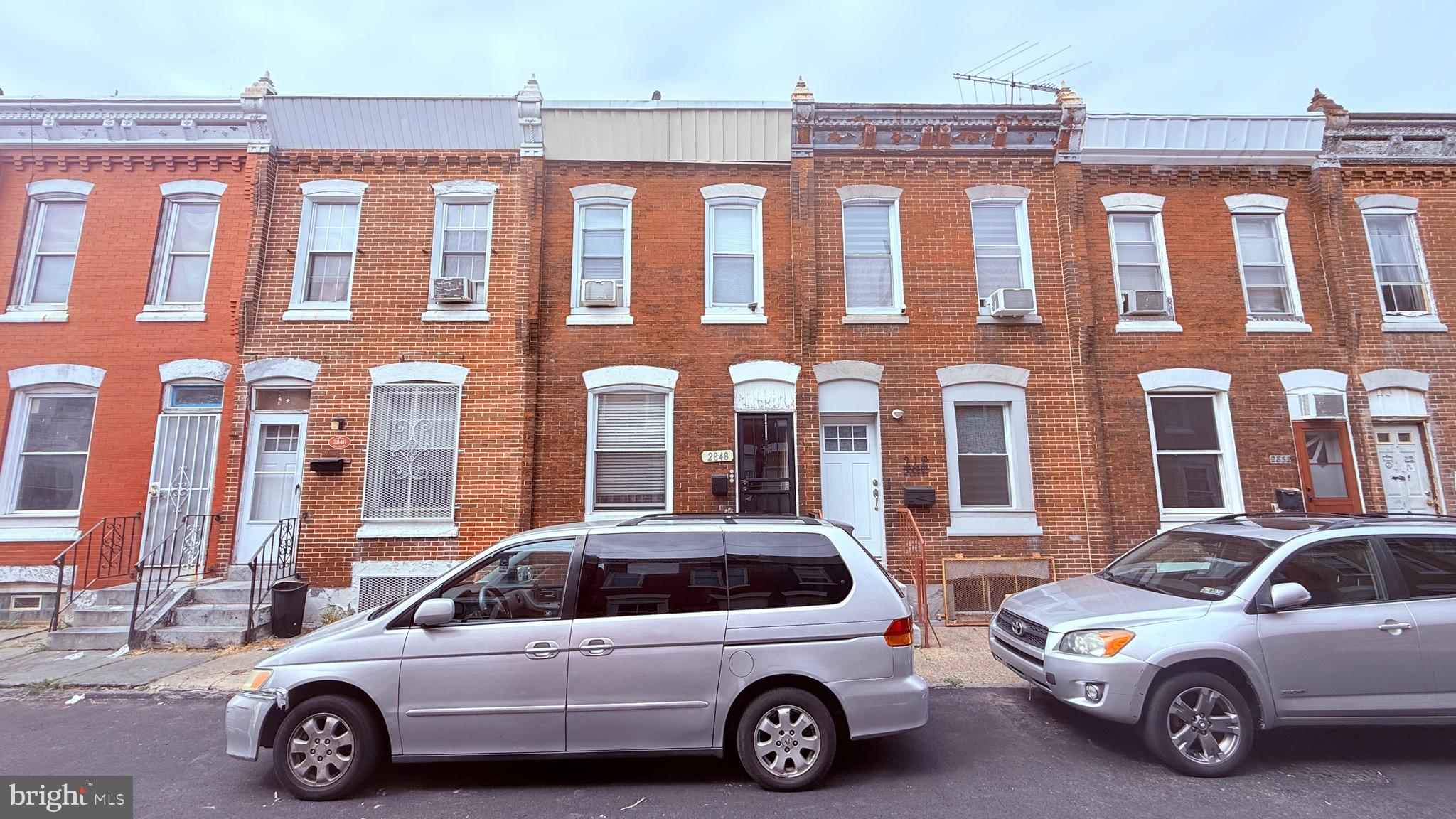 a view of a car parked in front of a building