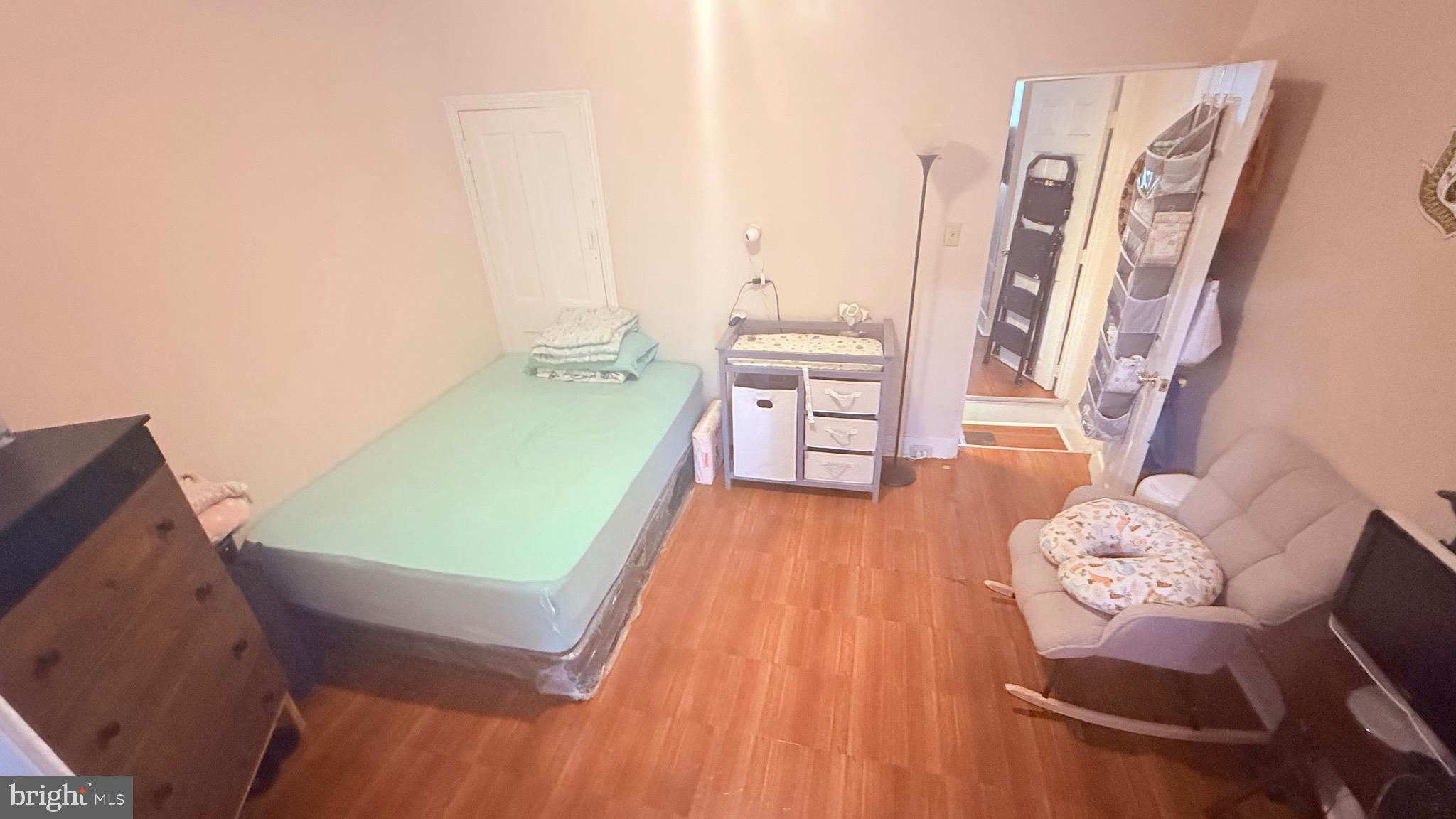 2848 North Lee Street Philadelphia, PA 19134 - Photo 23 of 26 a bed room with furniture and a wooden floor
