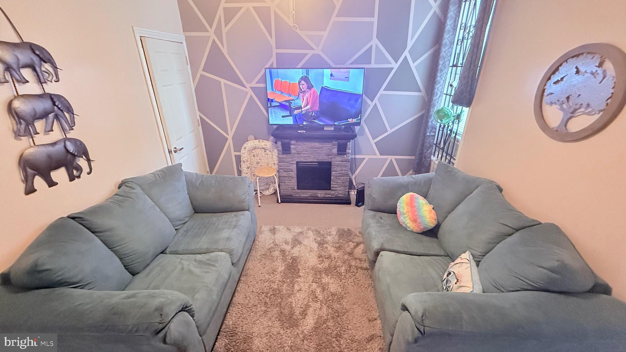 2848 North Lee Street Philadelphia, PA 19134 - Photo 7 of 26 a living room with furniture and a white wall