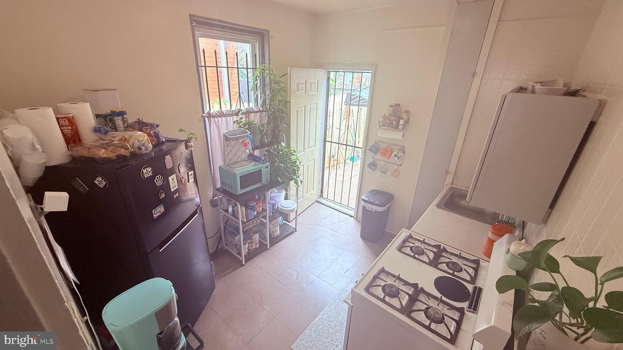 2848 North Lee Street Philadelphia, PA 19134 - Photo 8 of 26 a living room with furniture and a window