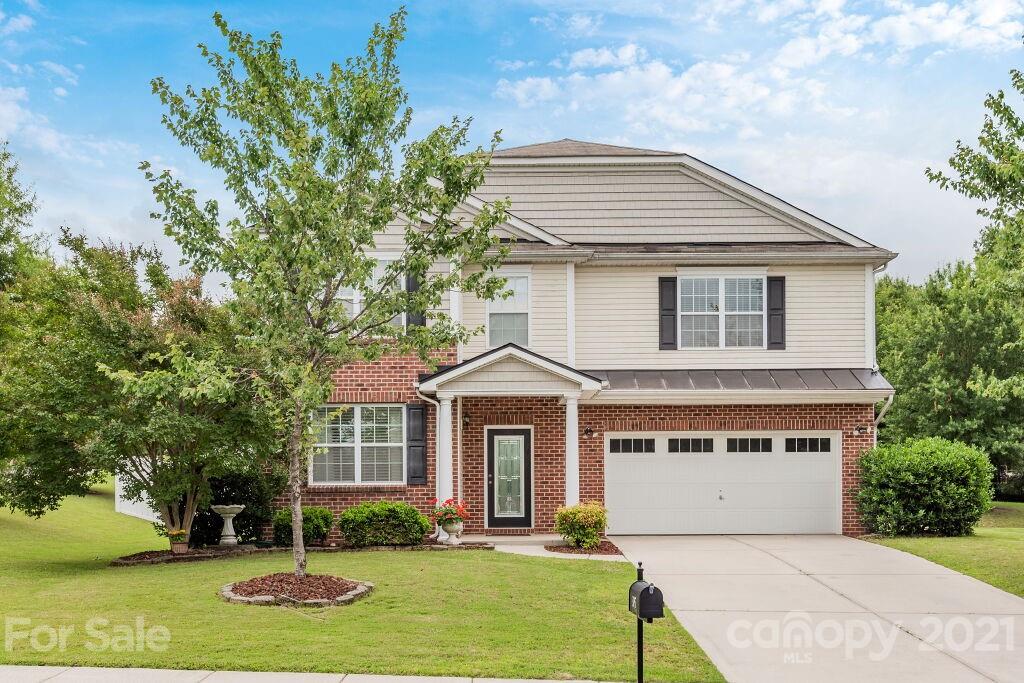 305 Allspice Road Fort Mill, SC 29708 - Photo 2 of 31 a front view of a house with a yard and garage