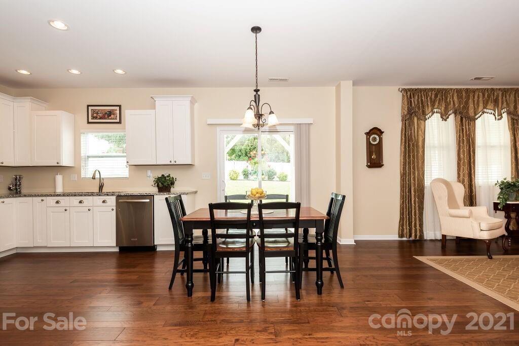305 Allspice Road Fort Mill, SC 29708 - Photo 20 of 31 a view of a dining room with furniture window and wooden floor
