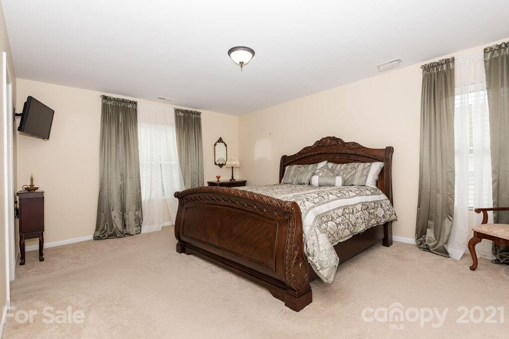 305 Allspice Road Fort Mill, SC 29708 - Photo 24 of 31 a bedroom with a bed and a view of bathroom