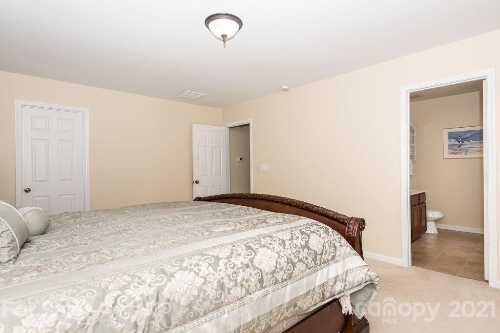 305 Allspice Road Fort Mill, SC 29708 - Photo 25 of 31 a bedroom with a bed and a view of bathroom