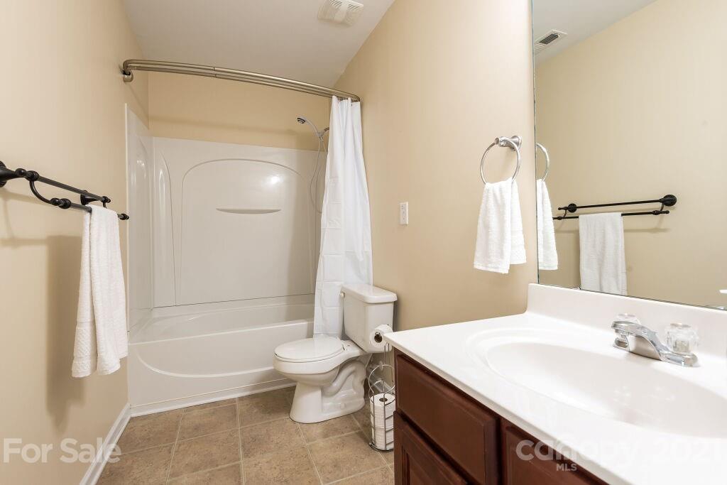 305 Allspice Road Fort Mill, SC 29708 - Photo 31 of 31 a bathroom with a sink a toilet and shower