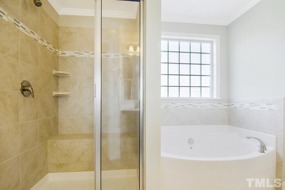 35 Waterpine Drive Garner, NC 27529 - Photo 11 of 25 a bathroom with a bathtub