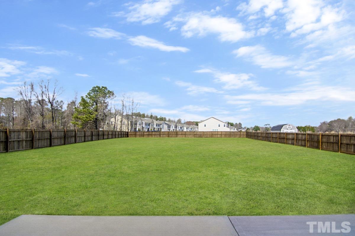 35 Waterpine Drive Garner, NC 27529 - Photo 13 of 25 a view of a field of grass and trees