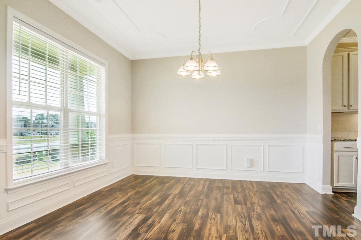 35 Waterpine Drive Garner, NC 27529 - Photo 18 of 25 a view of empty room with wooden floor and fan