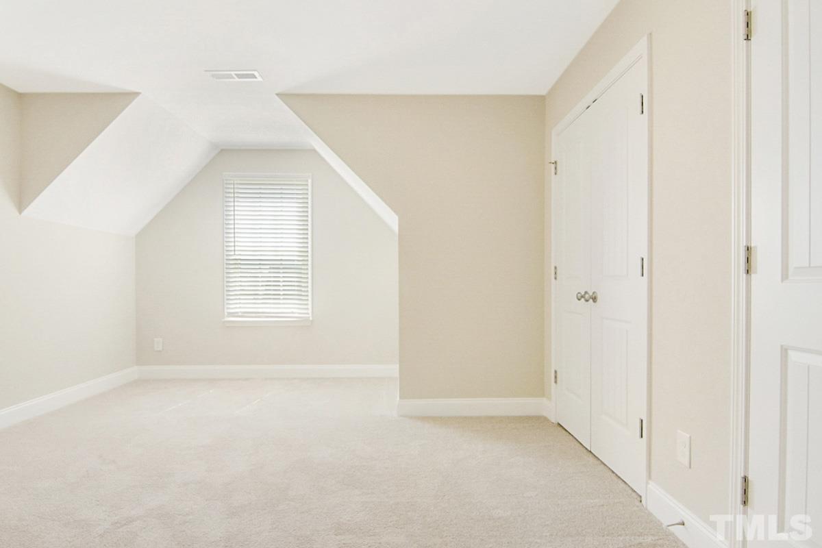 35 Waterpine Drive Garner, NC 27529 - Photo 21 of 25 an empty room with windows