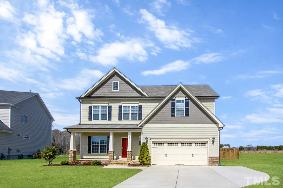 35 Waterpine Drive Garner, NC 27529 - Photo 3 of 25 a front view of a house with garden