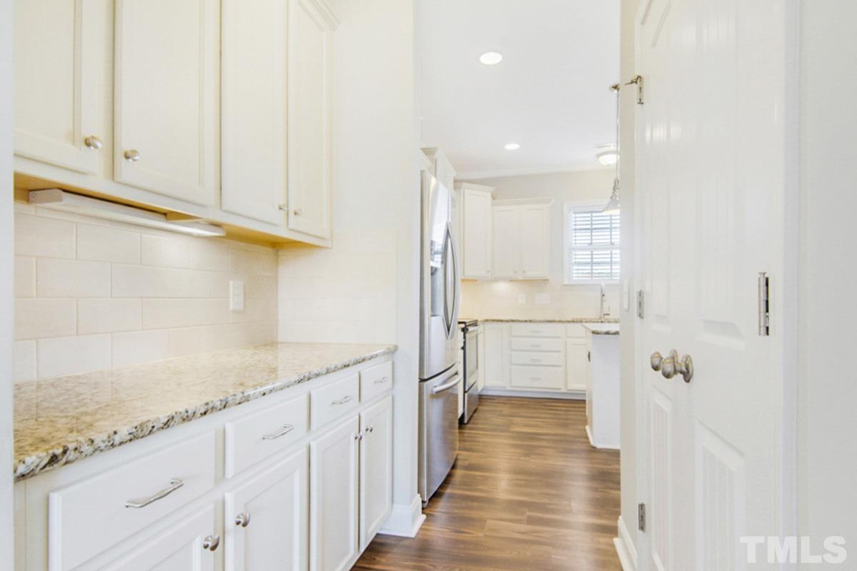 35 Waterpine Drive Garner, NC 27529 - Photo 7 of 25 a view of a walk in closet and wooden floor