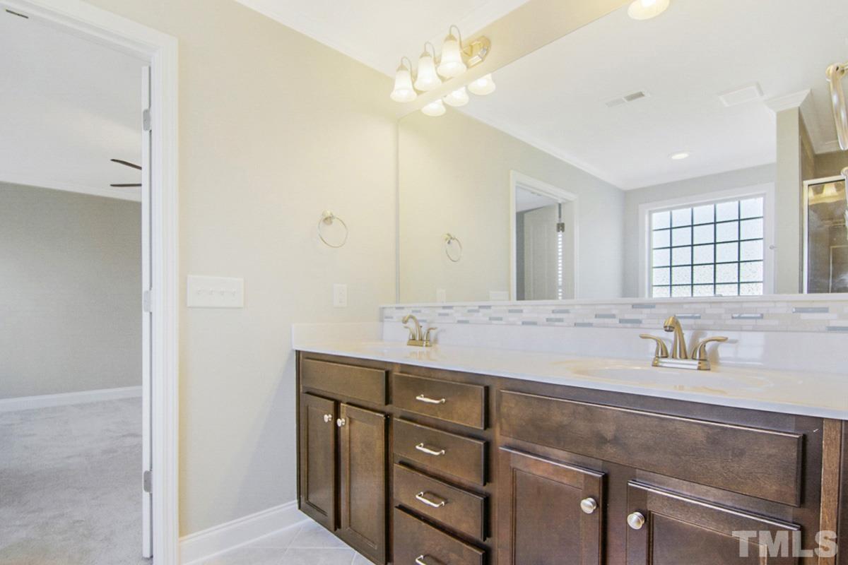 35 Waterpine Drive Garner, NC 27529 - Photo 10 of 25 a bathroom with a sink double vanity and a mirror