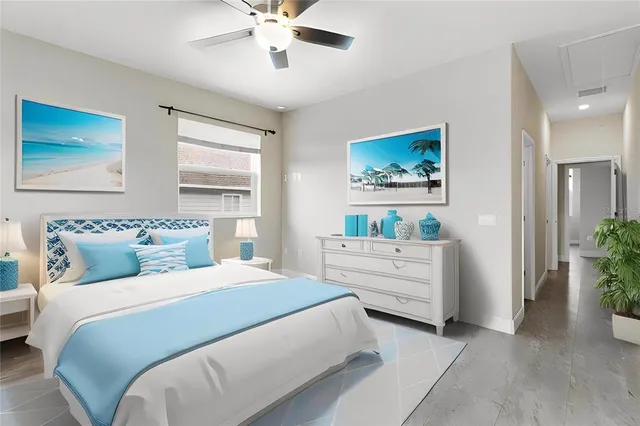 a bedroom with a bed and a painting on the wall