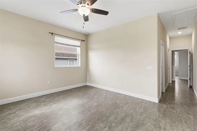 a view of an empty room with a window