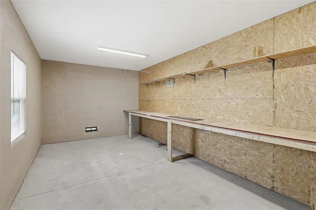 a view of an empty room with windows