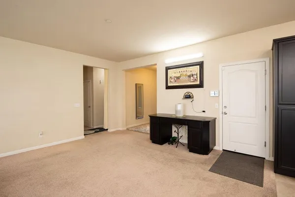 a view of a livingroom with furniture and cabinet
