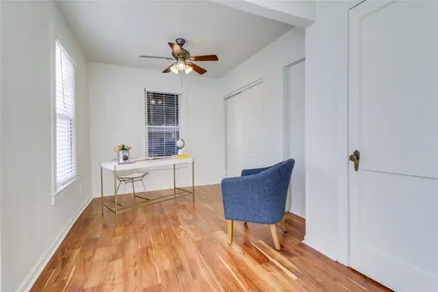 a work room with furniture and windows