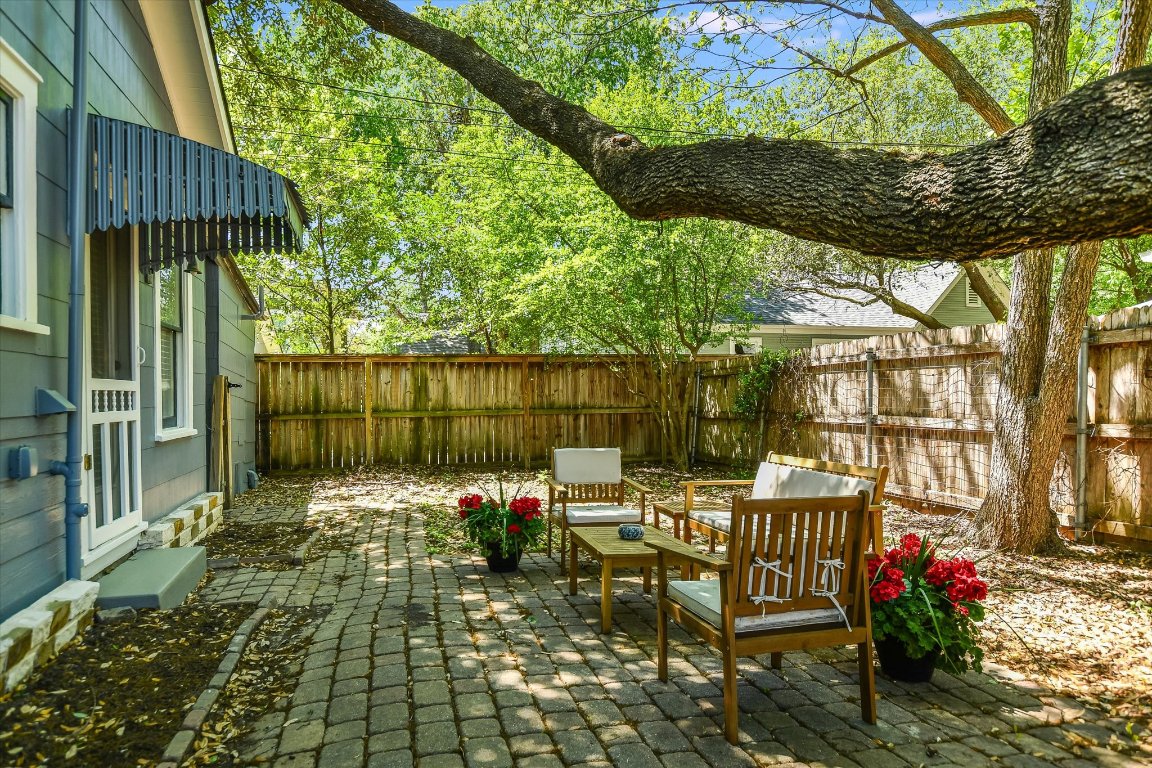 1105 West 43rd Street Austin, TX 78756 - Photo 22 of 22 a view of a tables and chairs under an umbrella