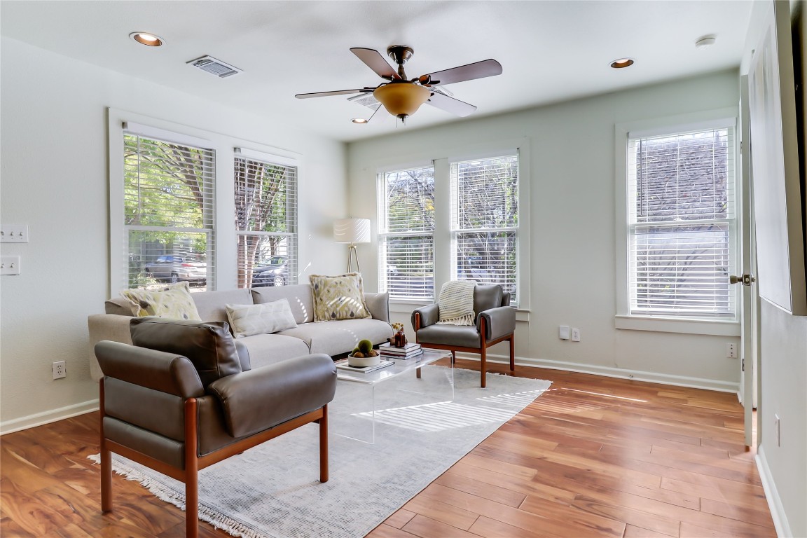 1105 West 43rd Street Austin, TX 78756 - Photo 5 of 22 a living room with furniture ceiling fan and a large window