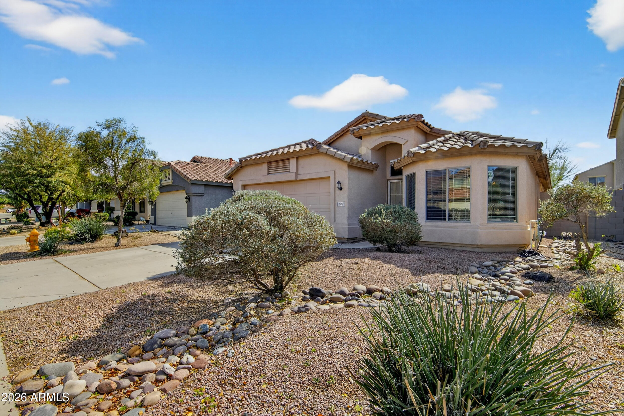 515 West Love Road San Tan Valley, AZ 85143 - Photo 1 of 74 a front view of a house with a yard and garage