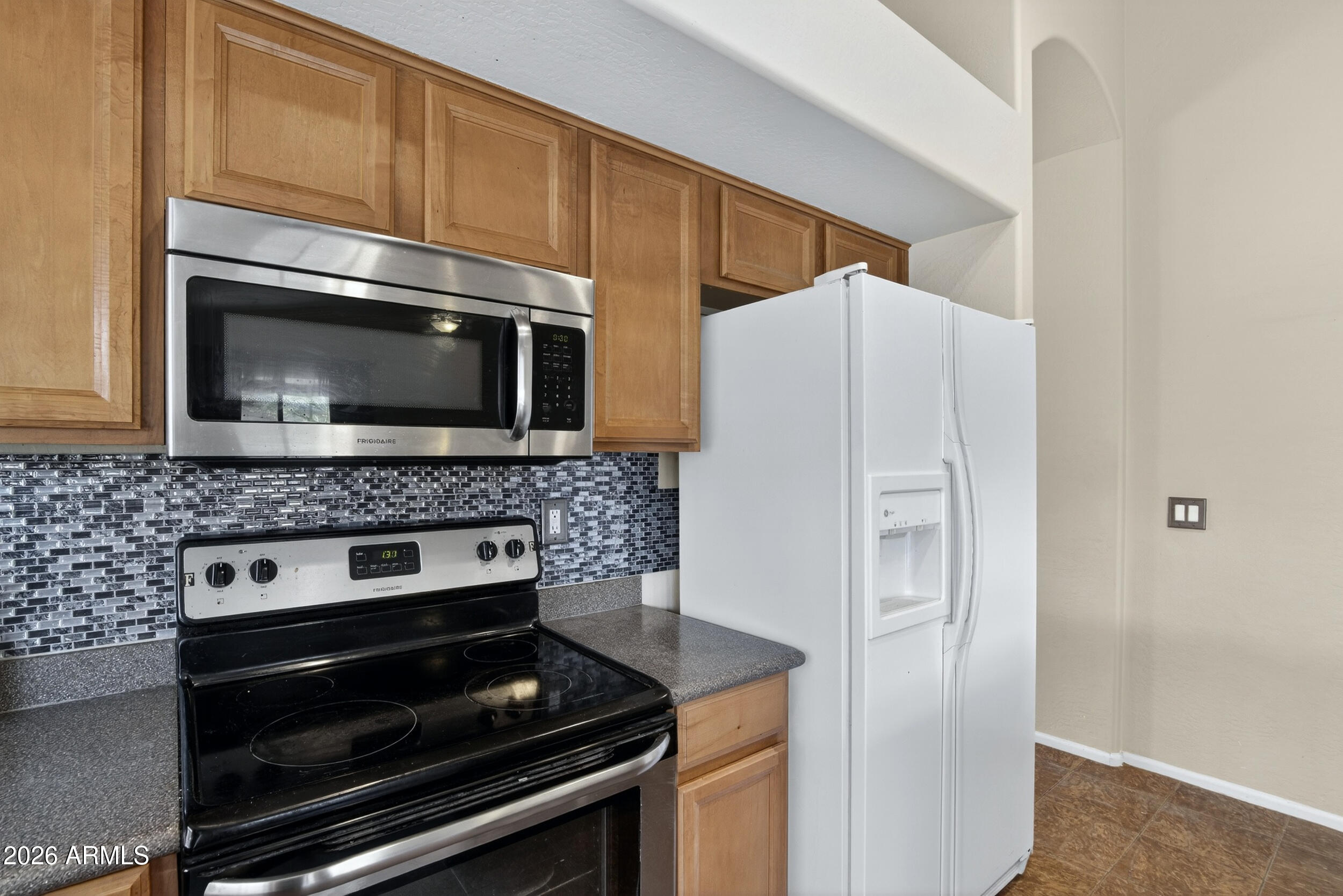 515 West Love Road San Tan Valley, AZ 85143 - Photo 10 of 74 a kitchen with granite countertop cabinets and steel stainless steel appliances