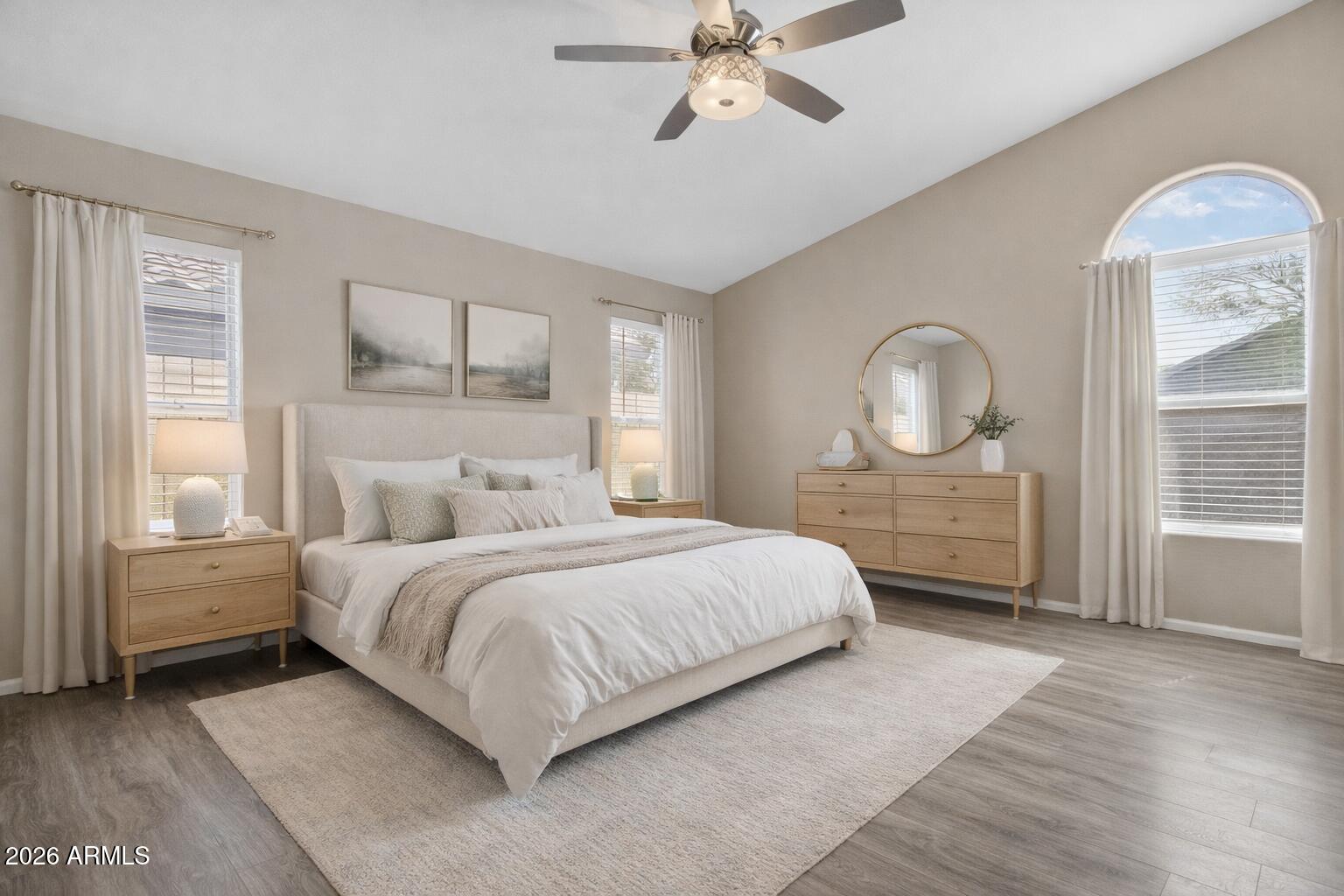 515 West Love Road San Tan Valley, AZ 85143 - Photo 18 of 74 a spacious bedroom with a large bed and a chandelier