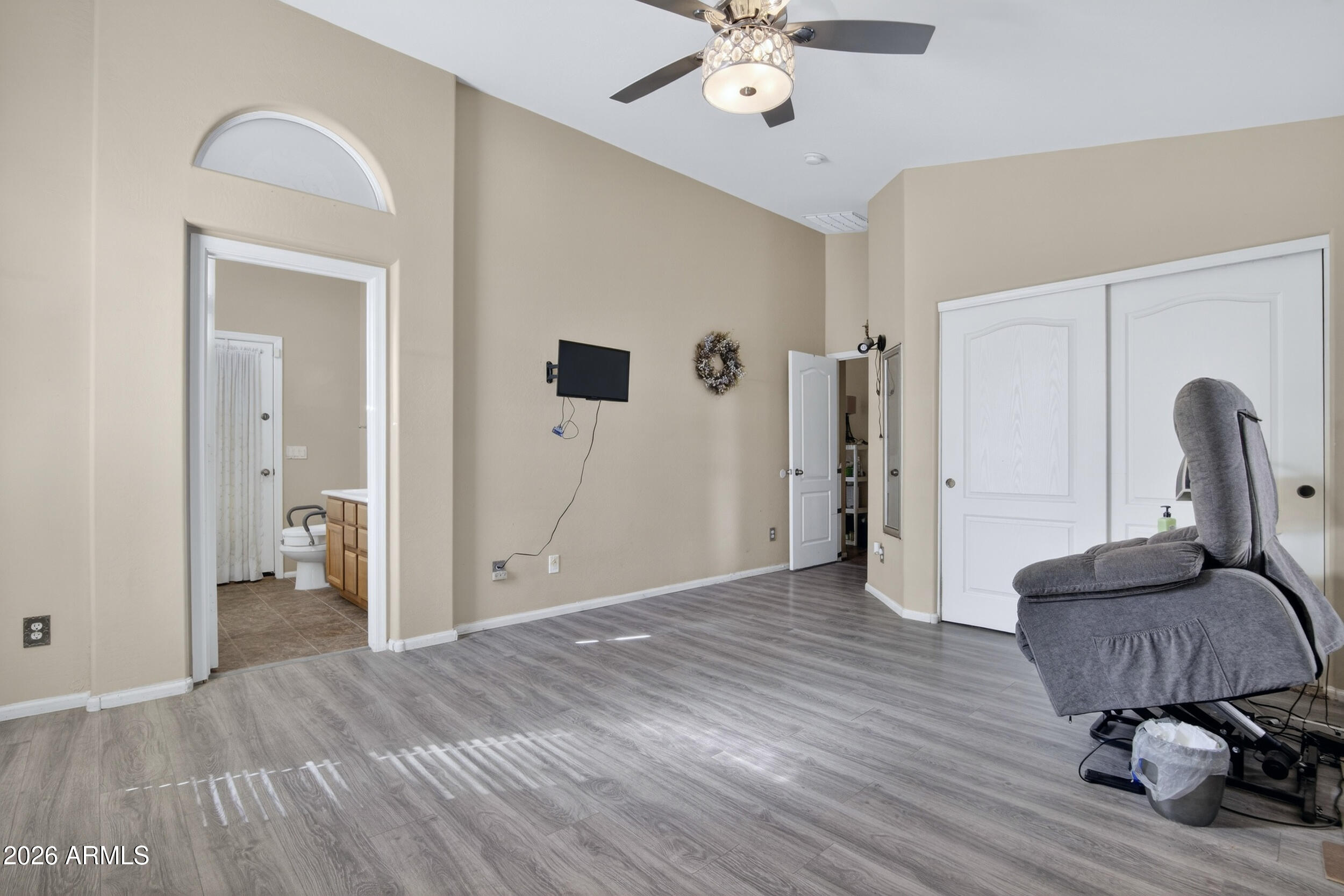 515 West Love Road San Tan Valley, AZ 85143 - Photo 19 of 74 a view of a room with wooden floor and a ceiling fan
