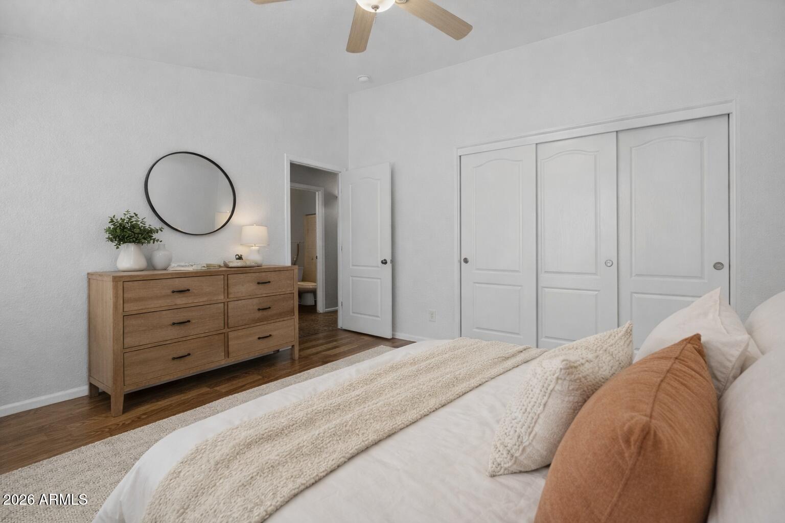 515 West Love Road San Tan Valley, AZ 85143 - Photo 22 of 74 a bedroom with a large bed and a chandelier