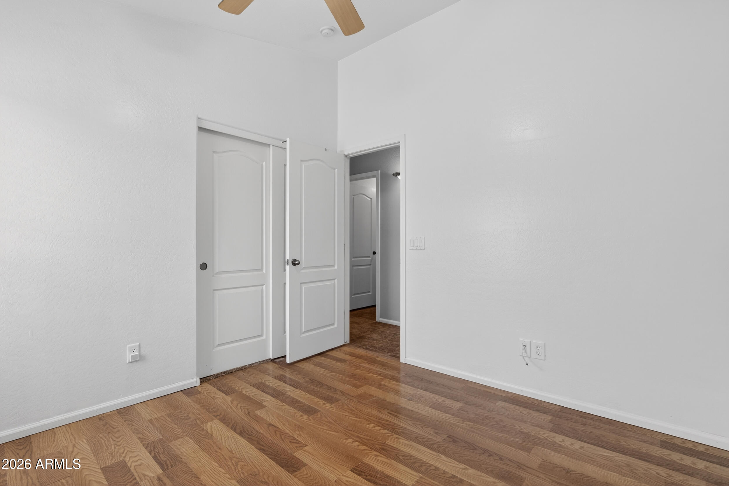 515 West Love Road San Tan Valley, AZ 85143 - Photo 25 of 74 a view of an empty room with wooden floor