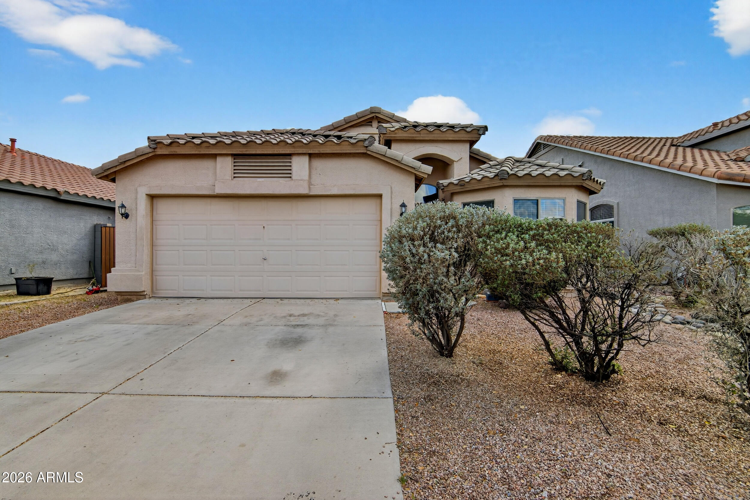 515 West Love Road San Tan Valley, AZ 85143 - Photo 3 of 74 a view of a white house with a outdoor space