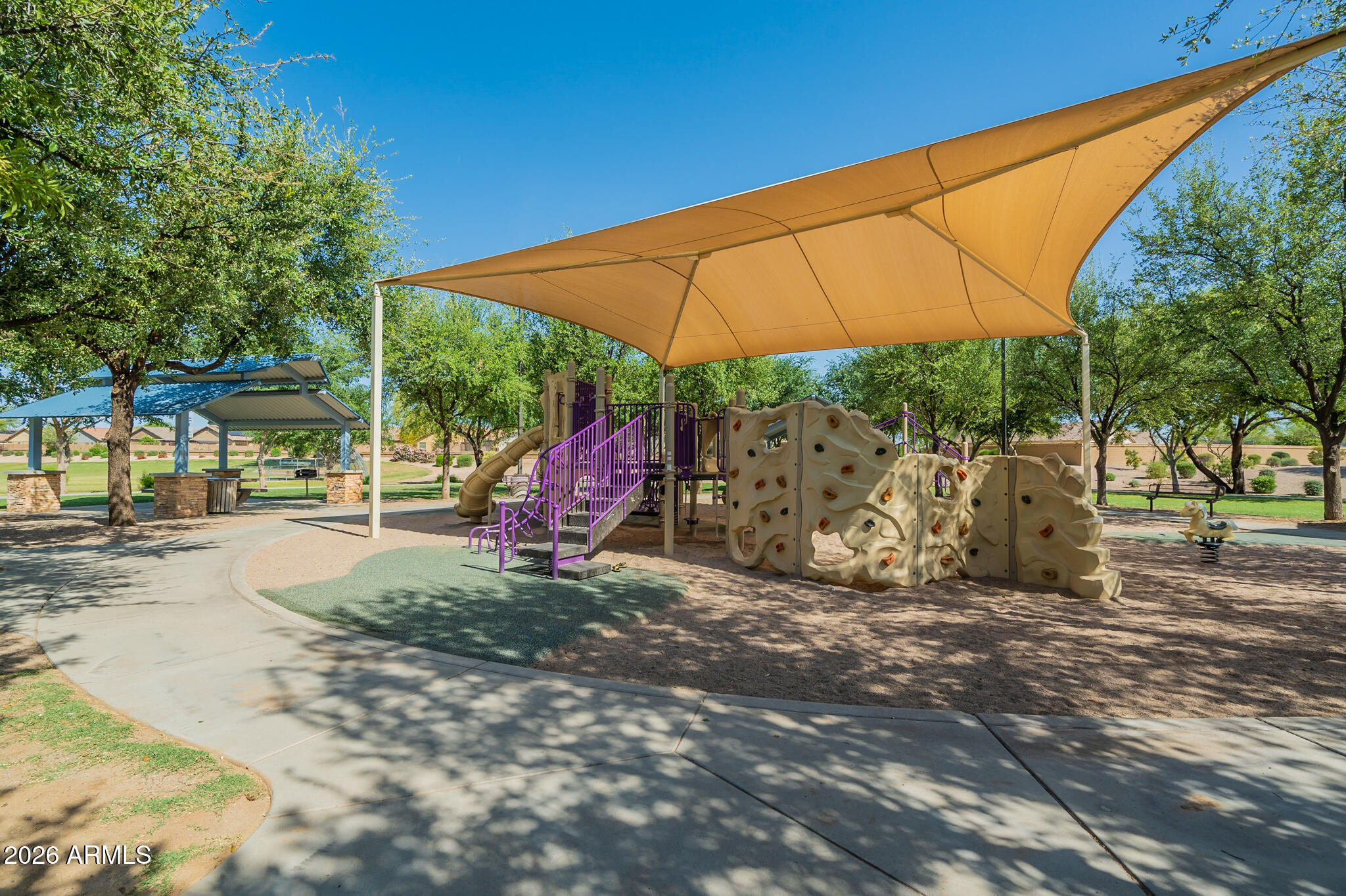515 West Love Road San Tan Valley, AZ 85143 - Photo 69 of 74 a view of a outdoor space with a table and chairs under an umbrella