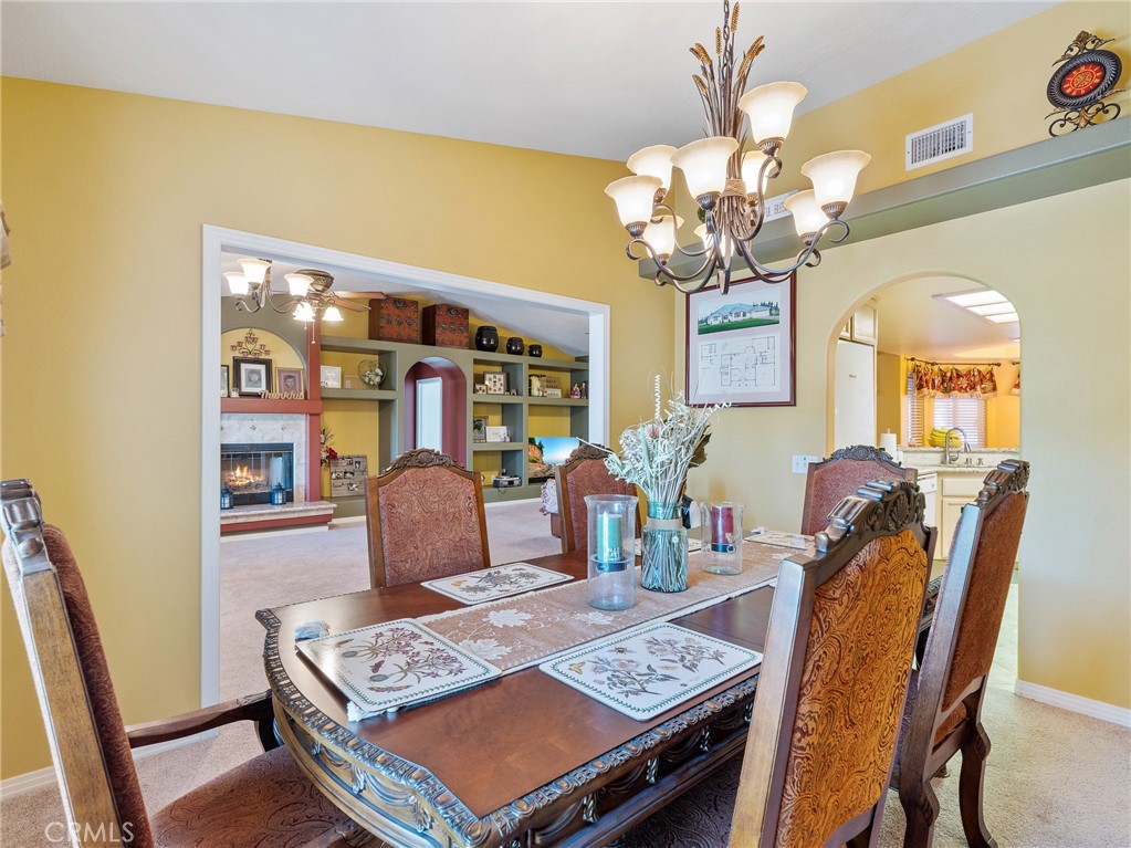 39429 Mountain View Road Yermo, CA 92398 - Photo 17 of 47 a view of a dining room with furniture and chandelier