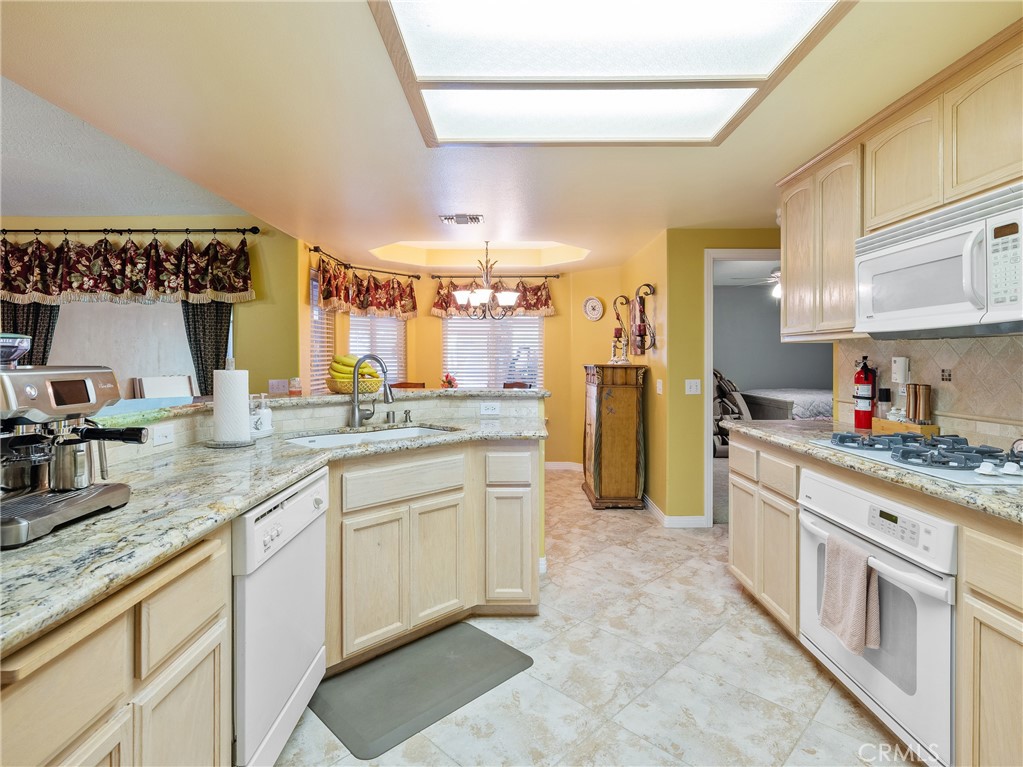 39429 Mountain View Road Yermo, CA 92398 - Photo 18 of 47 a kitchen with stainless steel appliances granite countertop a sink and cabinets