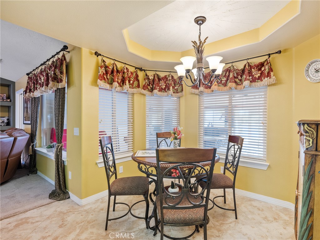 39429 Mountain View Road Yermo, CA 92398 - Photo 22 of 47 a view of a dining room with furniture and chandelier