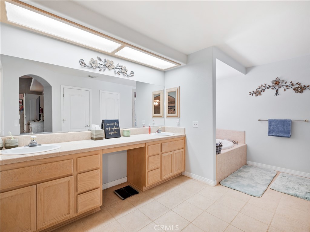 39429 Mountain View Road Yermo, CA 92398 - Photo 27 of 47 a spacious bathroom with a double vanity sink mirror and bathtub