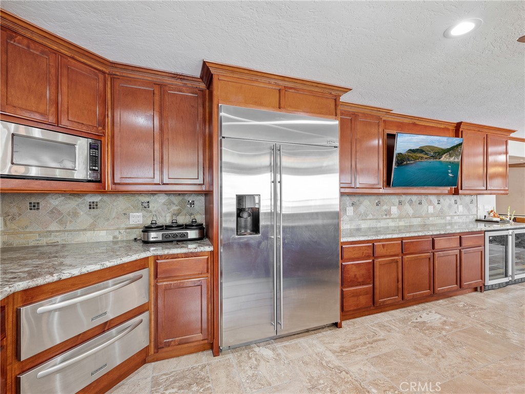 39429 Mountain View Road Yermo, CA 92398 - Photo 37 of 47 a kitchen with stainless steel appliances granite countertop a stove a sink and a microwave