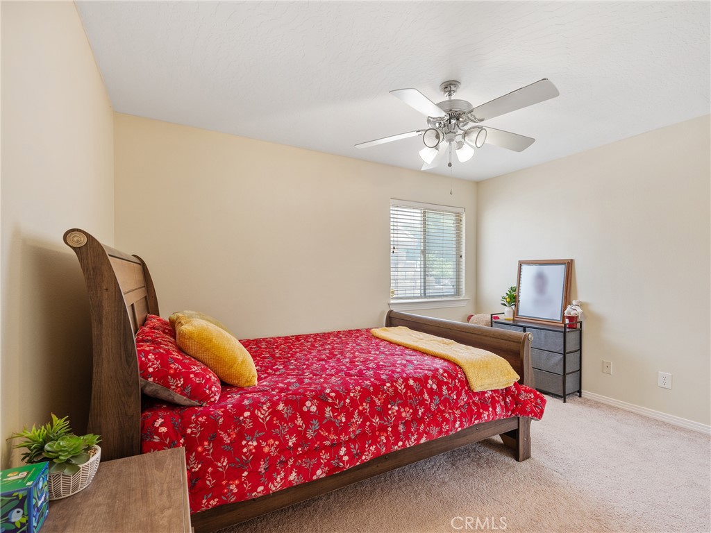 39429 Mountain View Road Yermo, CA 92398 - Photo 40 of 47 a bedroom with a bed and a chandelier