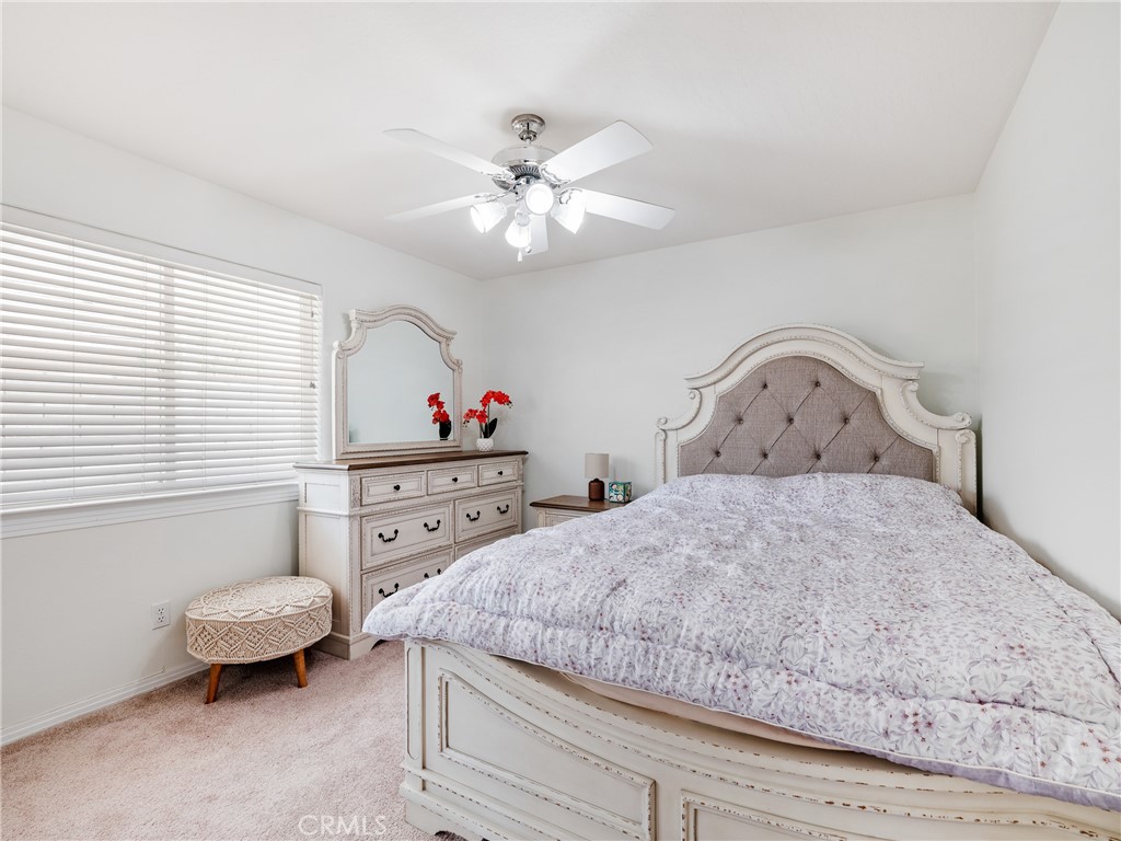39429 Mountain View Road Yermo, CA 92398 - Photo 41 of 47 a bedroom with a bed and a chandelier