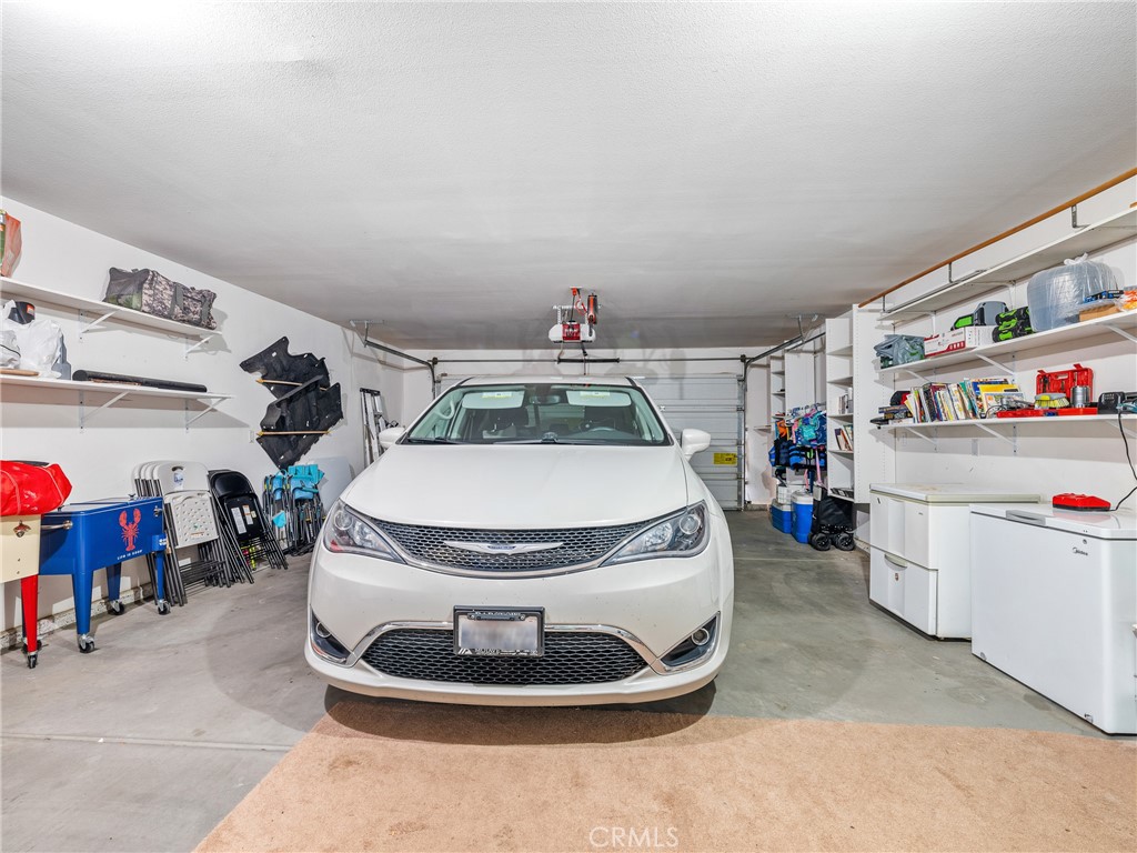 39429 Mountain View Road Yermo, CA 92398 - Photo 44 of 47 a room with lots of clutter and lots of frames on wall