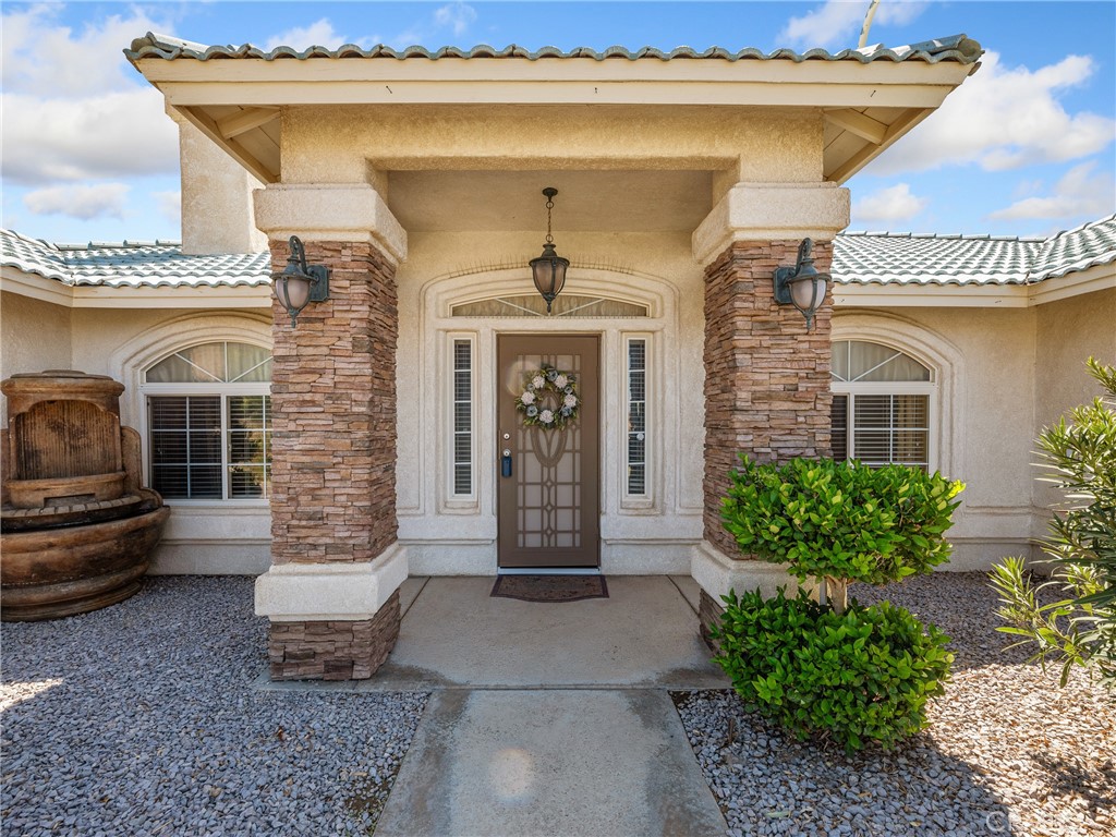 39429 Mountain View Road Yermo, CA 92398 - Photo 10 of 47 a front view of a house with garden