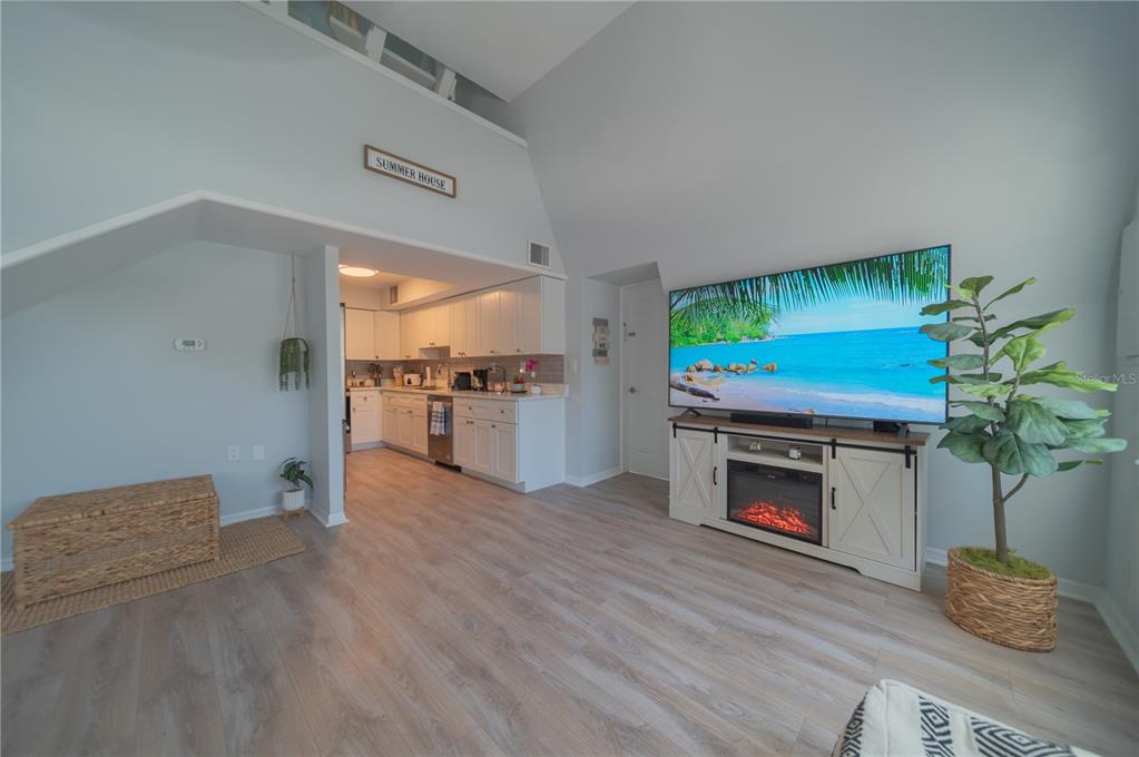 501 Pameto Road Nokomis, FL 34275 - Photo 2 of 37 a living room with furniture and a fireplace